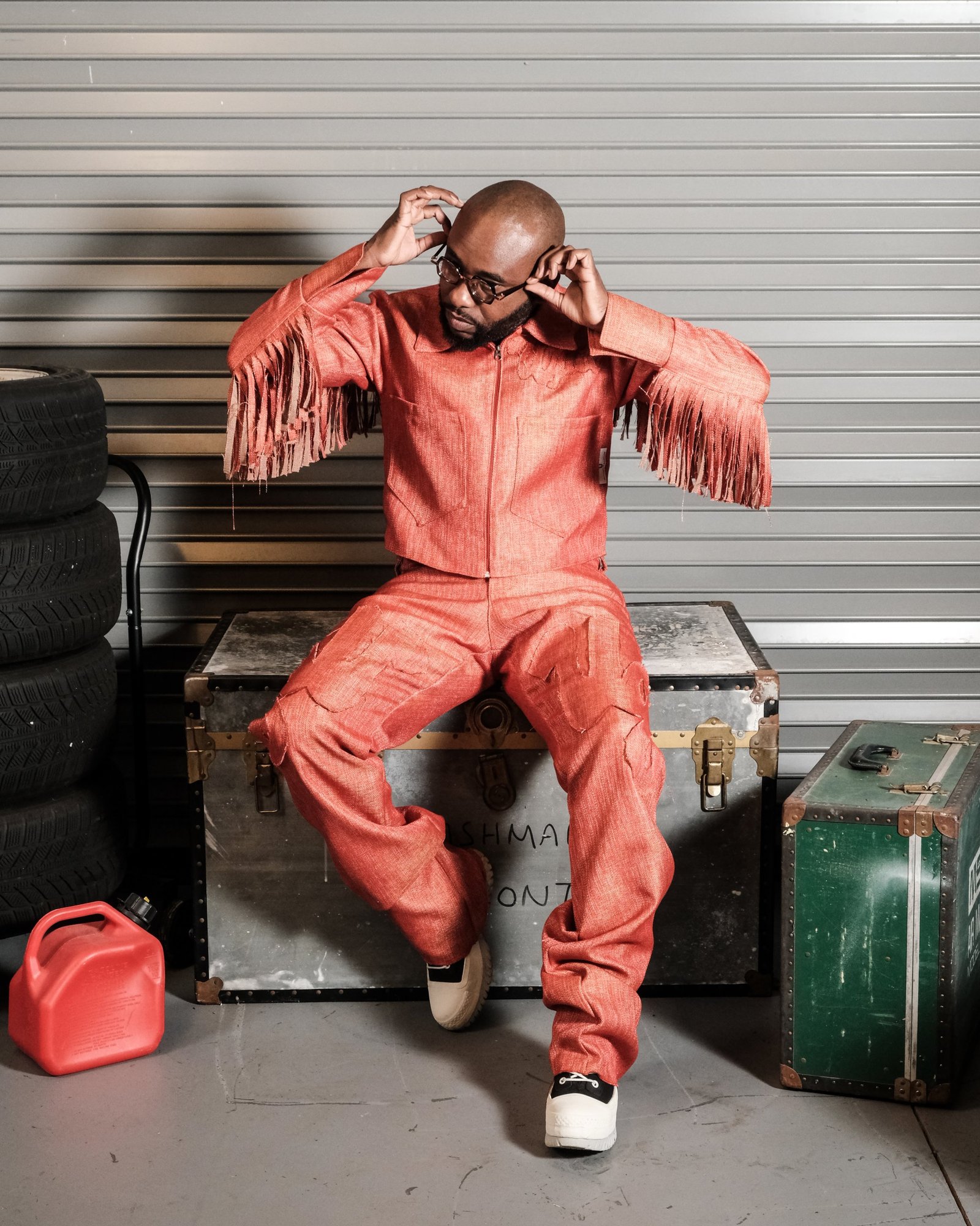 UGLIE look 03, rust fringe-sleeve jumpsuit