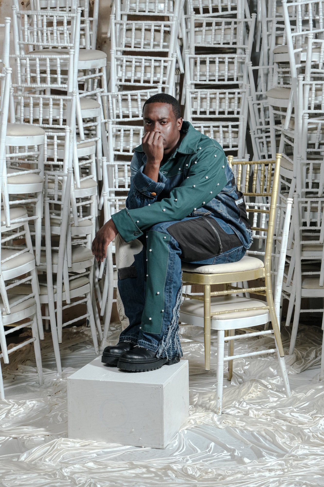 UGLIE look 07, pearl-studded green jacket over distressed denim